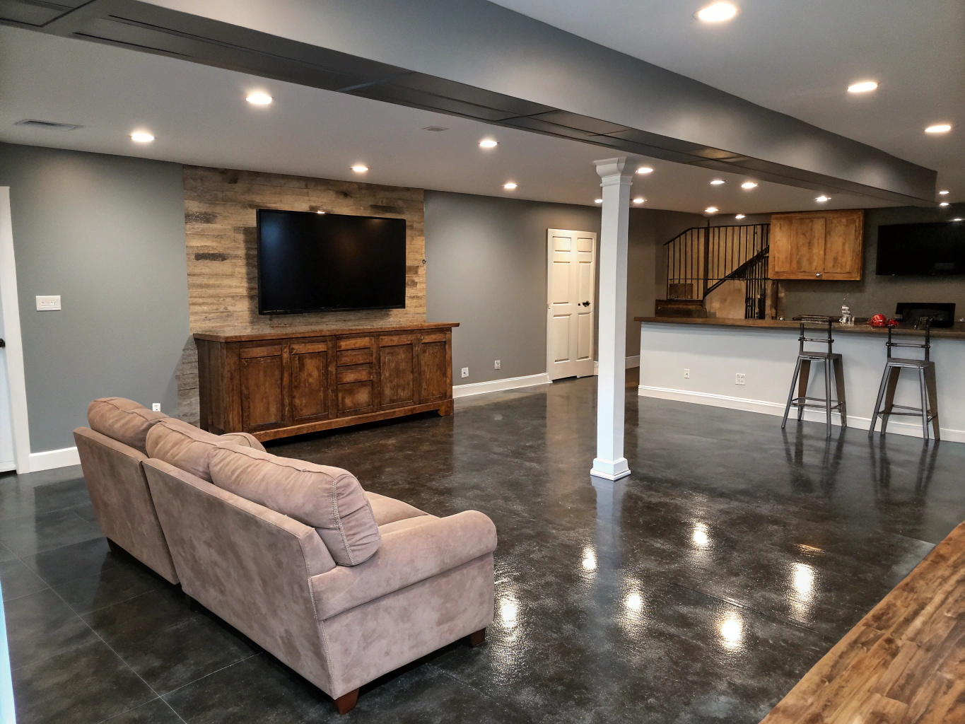 Finished basement space featuring recessed lighting and lounge seating