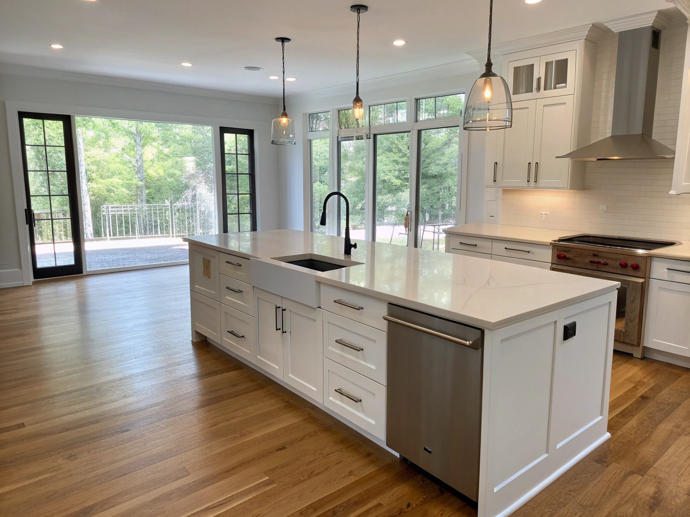 Spacious renovated Brookhaven kitchen with custom white shaker cabinets and marble waterfall island