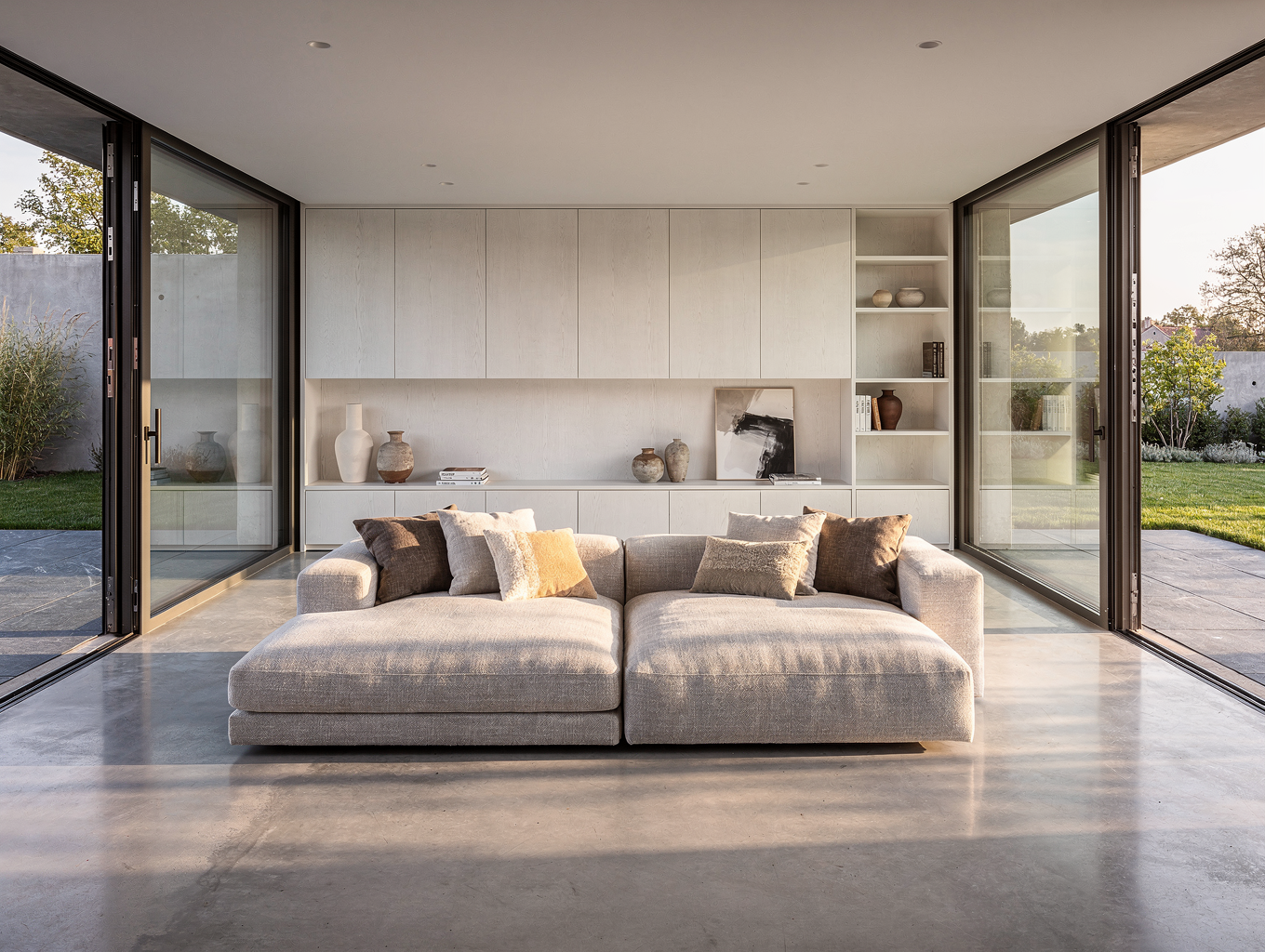 Open-concept Brookhaven living room with custom white oak ceiling beams and wide plank floors