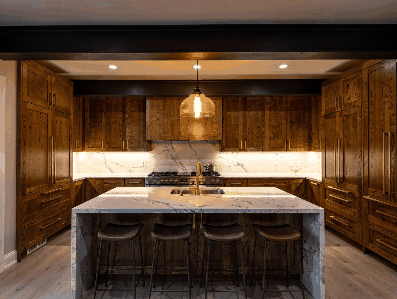 Finished modern luxury kitchen with white oak cabinets, marble island, and warm lighting