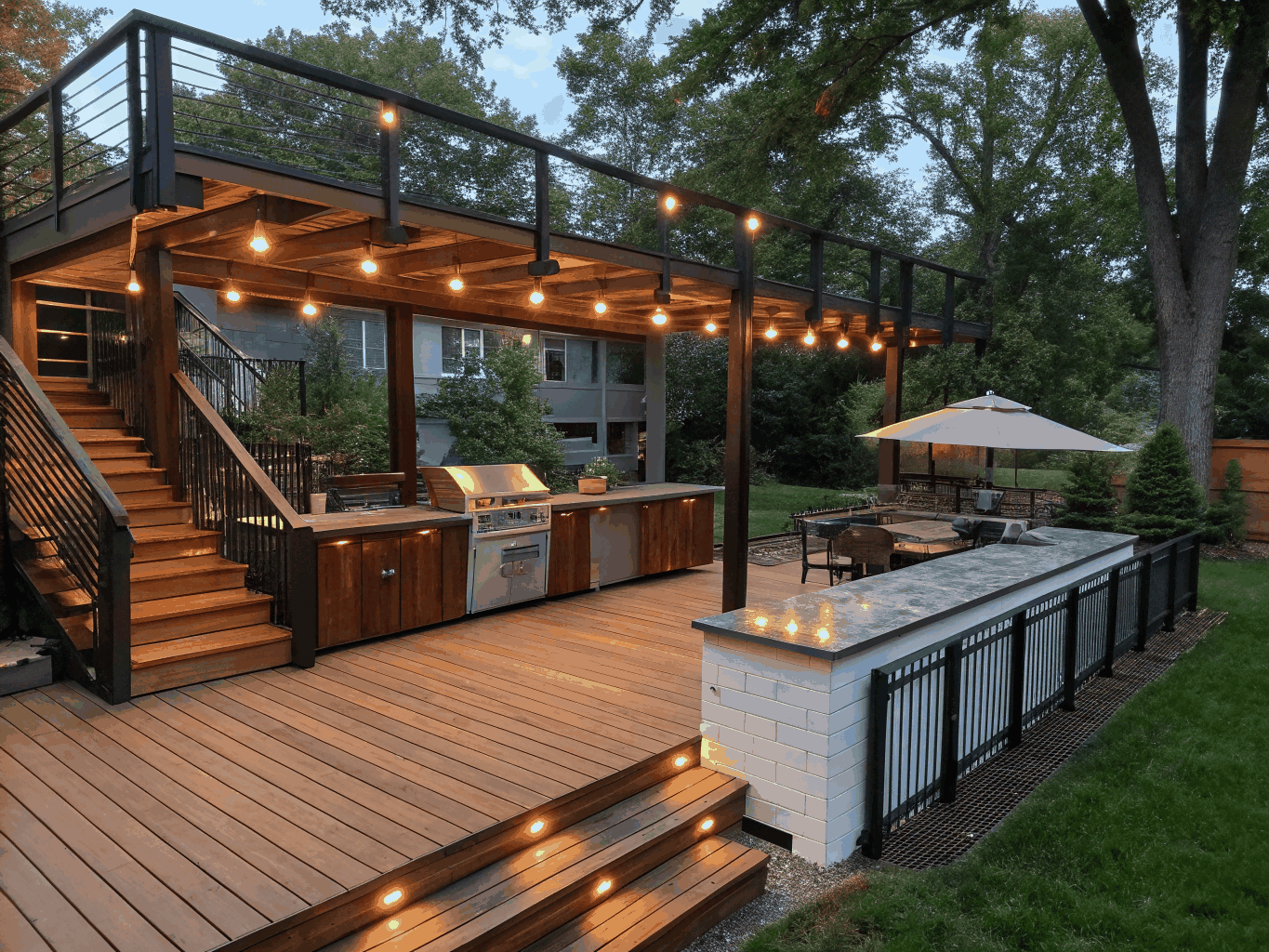 Completed multi-level outdoor deck with modern railing and outdoor seating