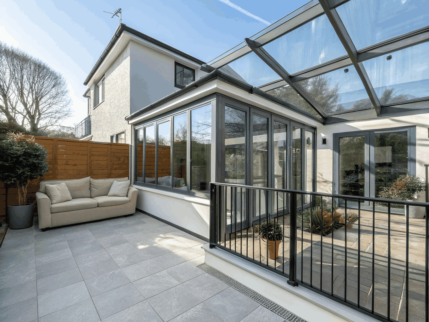 Completed light-filled luxury home addition with expansive windows and hardwood floors