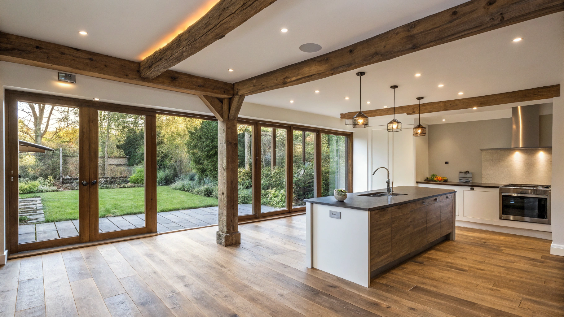 Bright open-concept kitchen and living room remodel with hardwood floors and recessed lighting