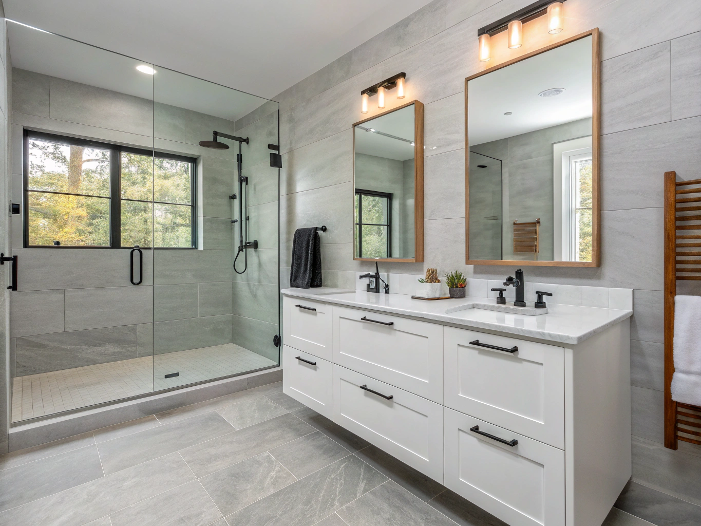 Modern guest ensuite bathroom with floating walnut vanity and herringbone tile