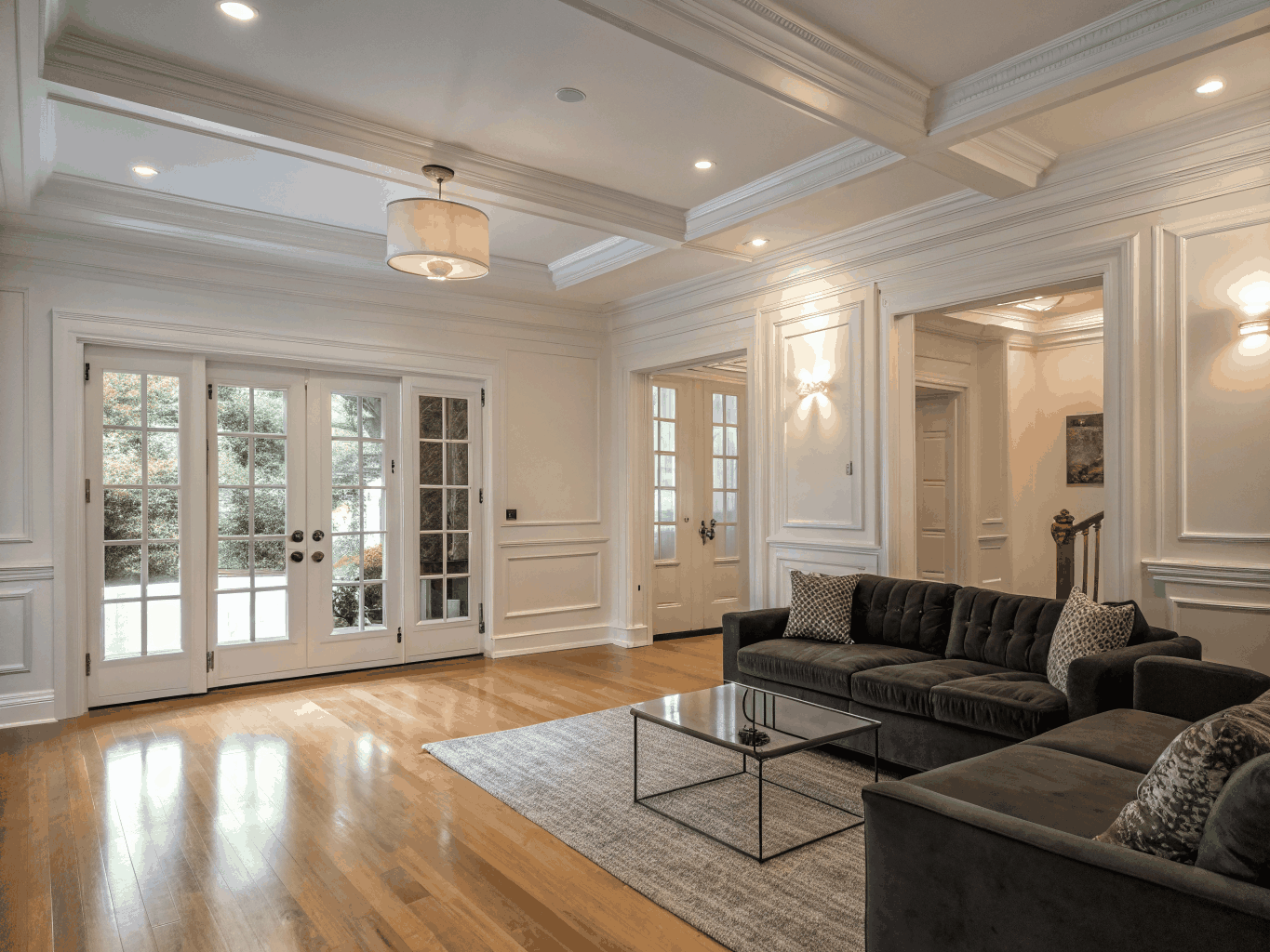 Bright, open-concept whole-home renovation with hardwood flooring and continuous architectural moldings